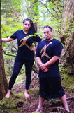 male and female models in black sasquatch reaching for moon t-shirts